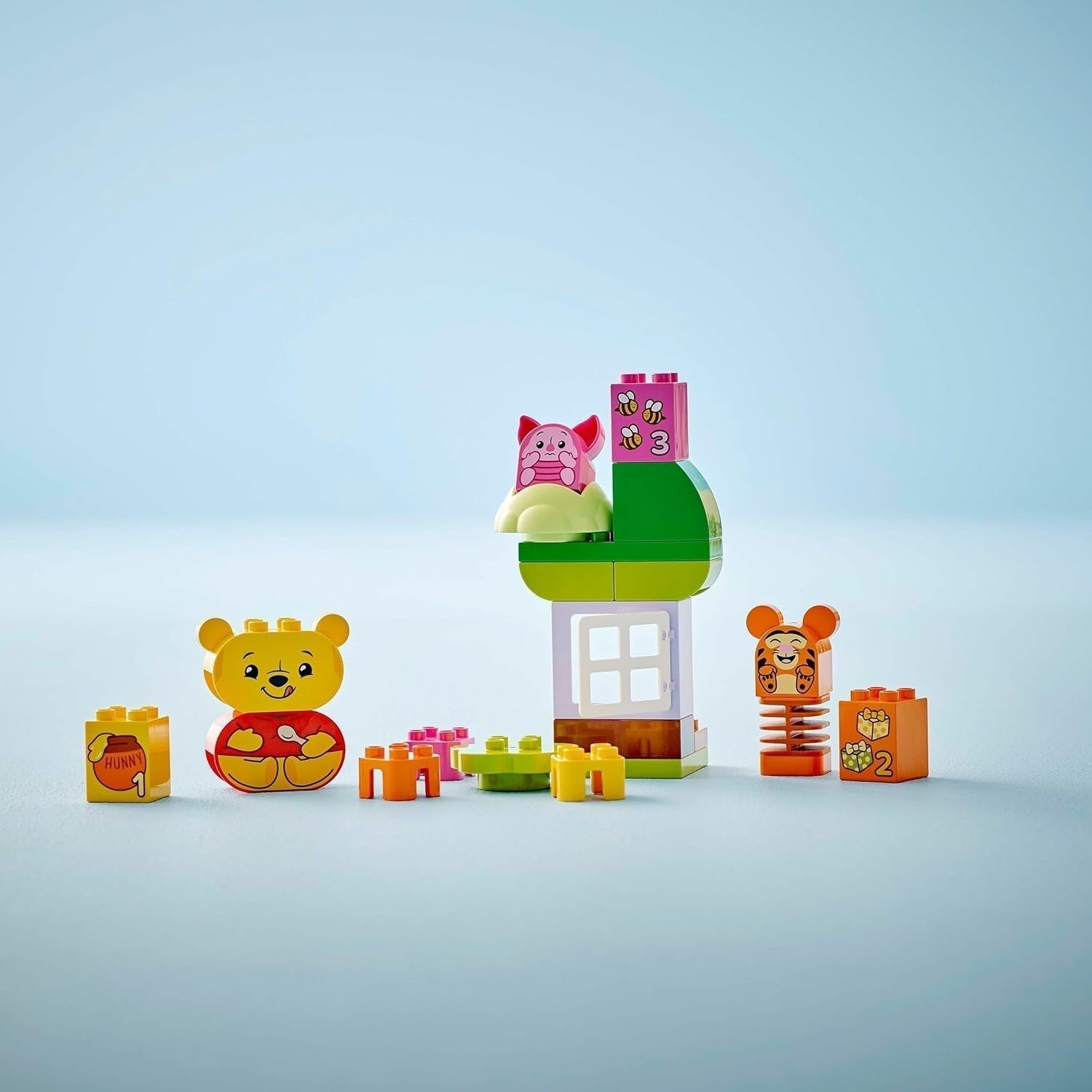 LEGO DUPLO - Disney Winnie de Poeh's verjaardagsfeestje - educatief speelgoed voor kleuters - set van 3 minifiguren waaronder Winnie de Poeh, Teigetje en Knorretje - cadeau-idee voor jongens en meisjes vanaf 1,5 jaar 10457 Beuche bouwsets in LEGO-Store