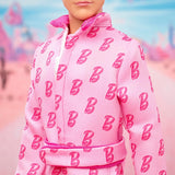 Barbie The Movie - Ken-Sammelpuppe, Ryan Gosling als Ken in rosafarbenem Overall met "B"-opdruk, witte sneaker en bunten Inlineskates, JCP80