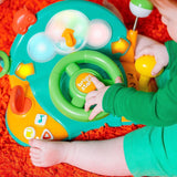 Bright Starts, speelgoedstuur, Lights & Colors Driver, met muziek, autogeluiden, richtingaanwijzers, versnellingspook en meer Bebe Naty Shop Speelgoed