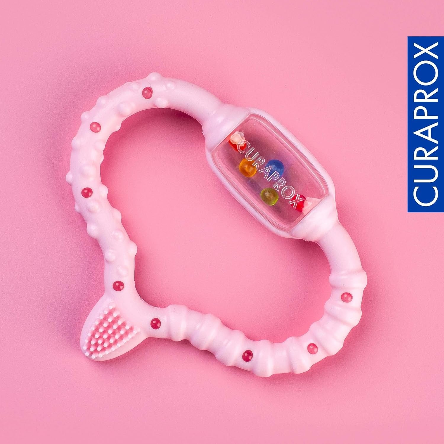 Bijtring Curaprox voor baby’s - Voor peuters 0-24 maanden/Verlicht tandpijn en bevordert motorische vaardigheden | BPA-vrij, Roze, met trainings-tandenborstel/Gemaakt in Zwitserland