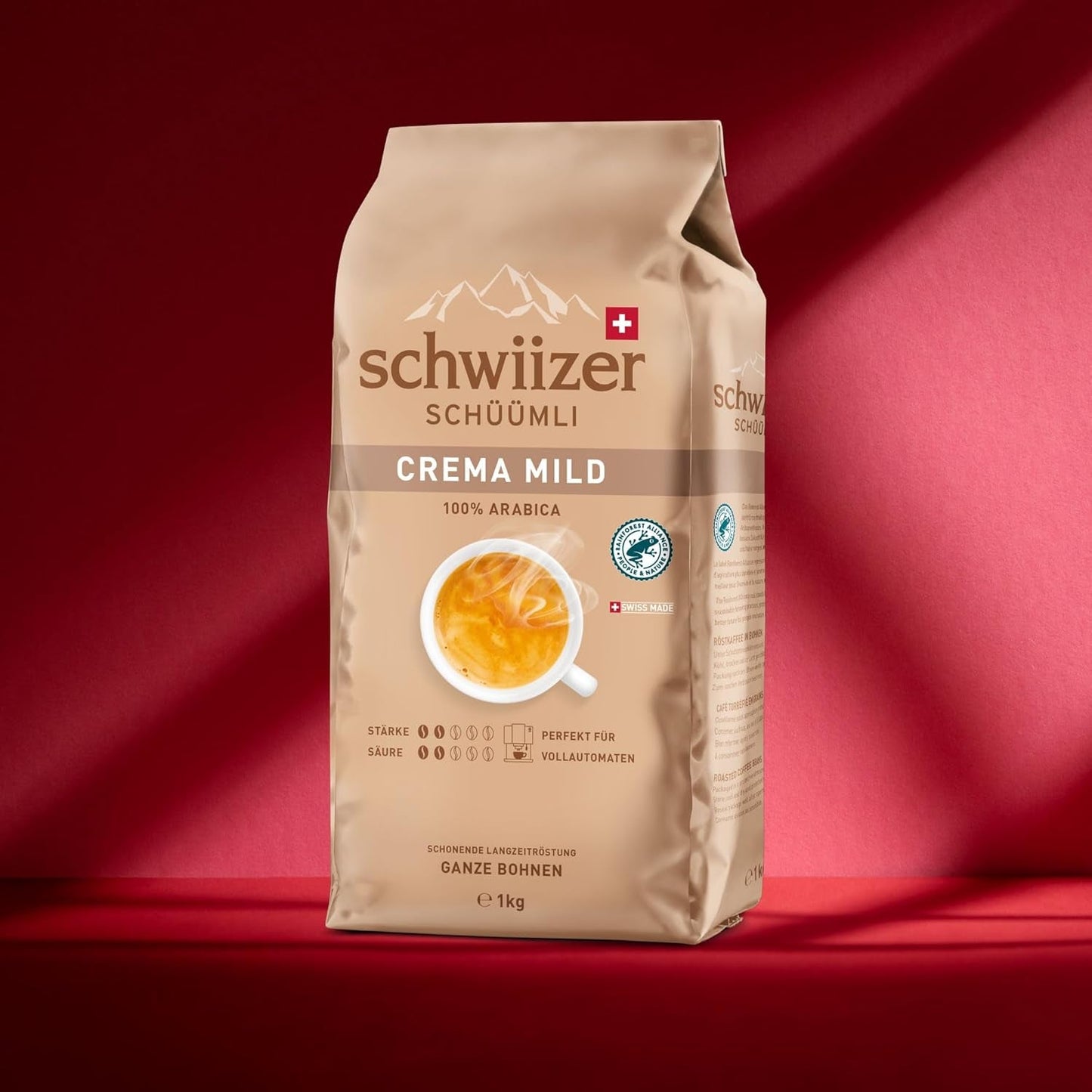 Schwiizer Schüümli Crema Mild, 100% premium Arabica koffiebonen, fruitig en nootachtig, voor volautomatische koffiemachines, 2/5 sterkte, licht gebrand, Rainforest Alliance gecertificeerd, 1 kg (pak van 2)