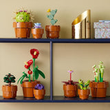 LEGO Icons Miniplanten, 9 bouwbare kunstbloemen, botanische collectieset voor volwassenen met bouwbare terracotta pot, huisdecoratie, cadeau voor dames en heren 10329 Bouwsets Bekijk de LEGO-Store