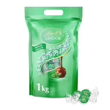 Lindt LINDOR Chocolade met Pistache | Hersluitbare zak van 1 kg | ca. 80 Melkchocoladeballetjes met smeltende pistacheroomvulling | Bulkverpakking, pralinegeschenk