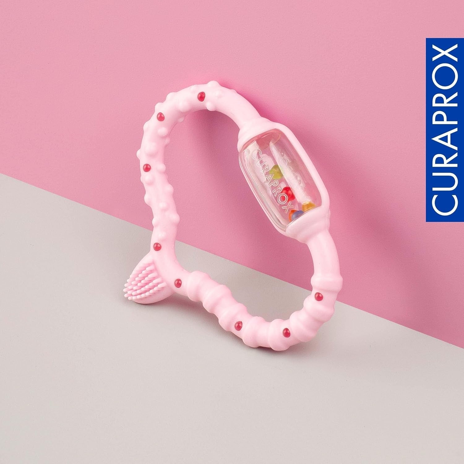 Bijtring Curaprox voor baby’s - Voor peuters 0-24 maanden/Verlicht tandpijn en bevordert motorische vaardigheden | BPA-vrij, Roze, met trainings-tandenborstel/Gemaakt in Zwitserland